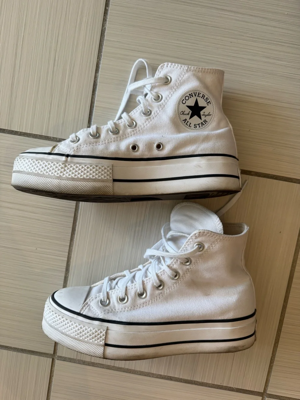 Converse Chuck Taylor’s White High Top Platform Sneakers
